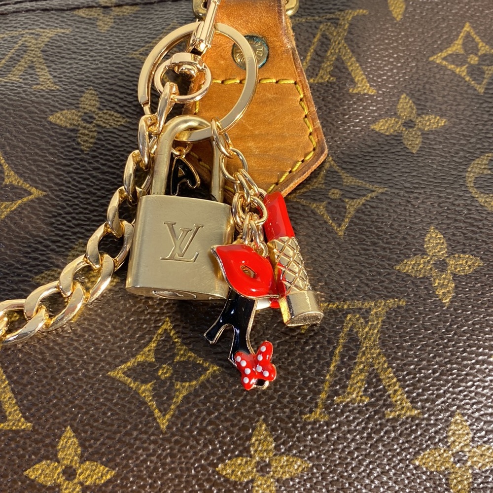 Authentic Louis Vuitton Lock on Charmed chain - Picture 3 of 6